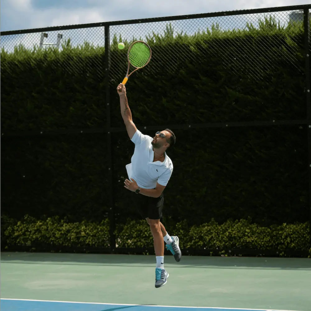 SolRX tennis sunscreen being used by a player on court; sweat-proof and high-performance UV protection
